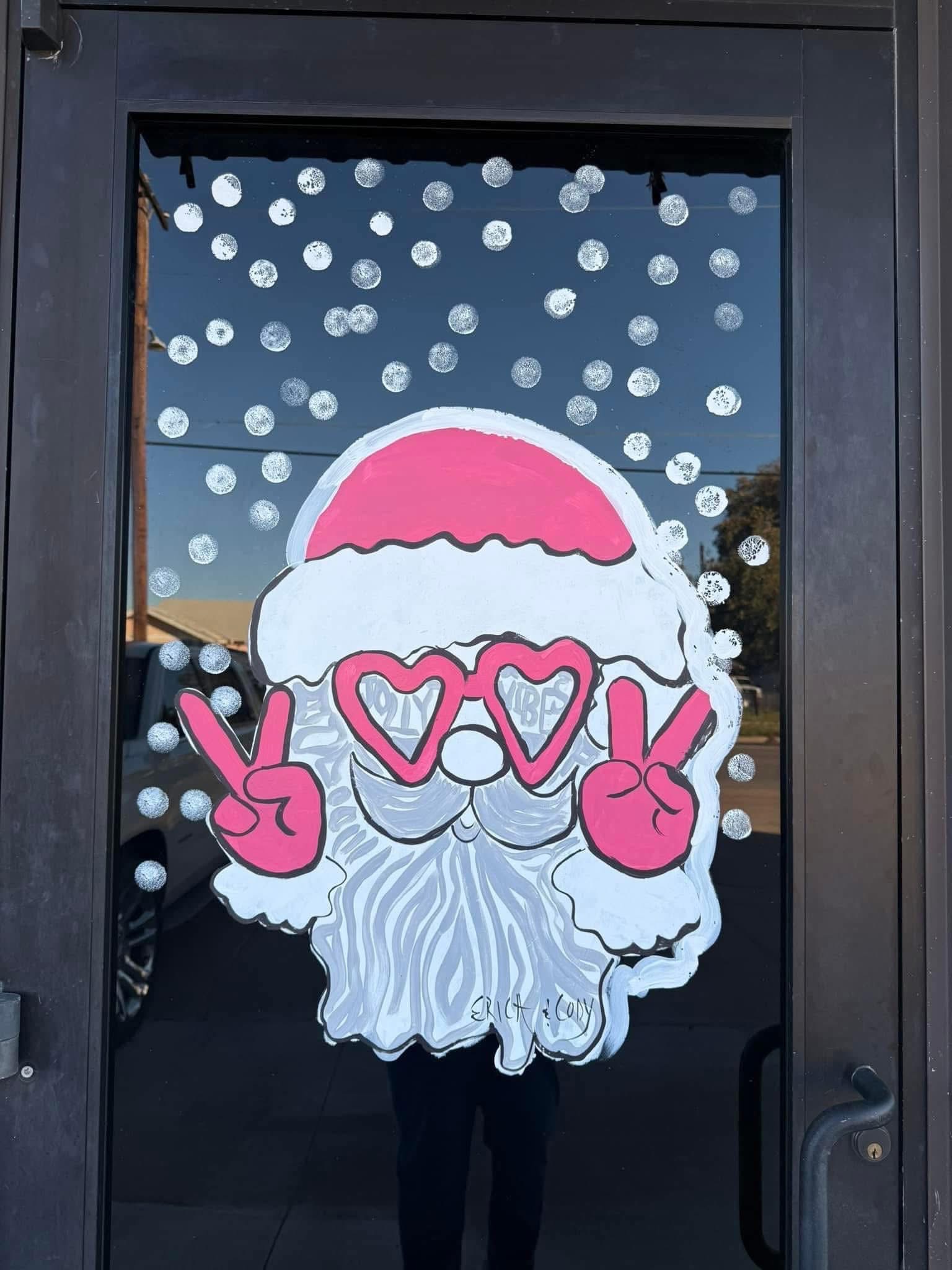 Holiday window painting of Santa
